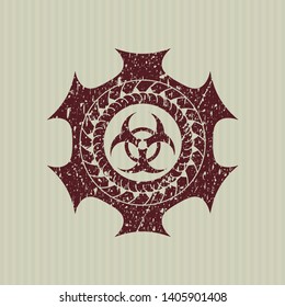 Red biohazard icon inside distress rubber grunge seal