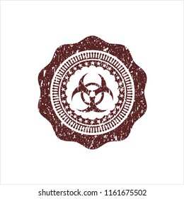 Red biohazard icon inside distressed rubber texture