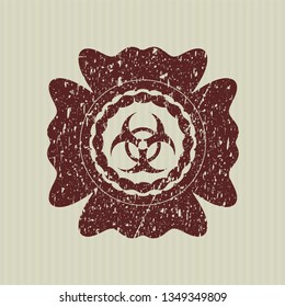 Red biohazard icon inside distressed grunge style stamp