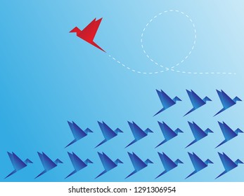 Red bird changing direction and blue ones. New idea, change, trend, courage, creative solution, innovation and unique way concept.