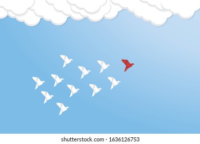 Red bird changing direction and white ones. New idea, change, trend, courage, creative solution, business, innovation and unique way concept 