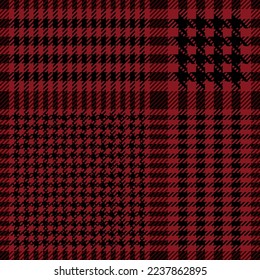 Red and black check plaid. Scottish houndstooth pattern fabric swatch close-up. 