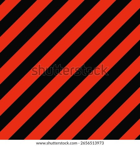 Red, black diagonal warning stripes background. An angled arrangement of lines. Ideal for backdrops, wallpapers and industrial signage.