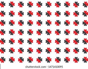 Red and black flowers on white background. Flower petals are heart shaped.