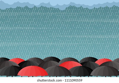 Red and black umbrella under rain.