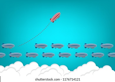 Red blimp changing direction and white ones. New idea, change, trend, courage, creative solution, innovation and unique way concept.