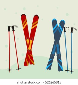 red and blue ski equipment in the snow. Winter background.