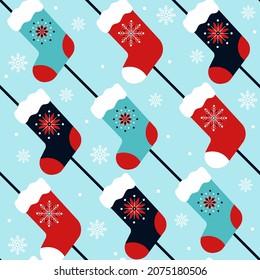 Red and blue vintage diagonal seamless pattern with christmas stockings and snowflakes. Great for fabric, wallpaper, wrapping paper.