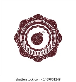 Red bomb icon inside distressed rubber stamp