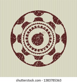 Red bomb icon inside grunge seal
