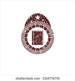 Red book icon inside distress rubber stamp