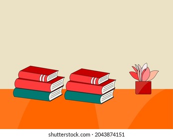 Red books on an orange desk