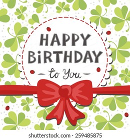 red bow on clover meadow with ladybugs birthday card with wishes in English