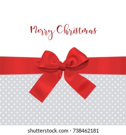Red bow ribbon Christmas decoration with polka dot background