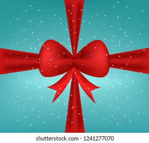 Red bow and snow fall.