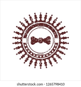 Red bow tie icon inside distress rubber texture