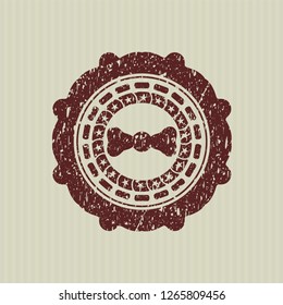 Red bow tie icon inside distress rubber grunge texture stamp