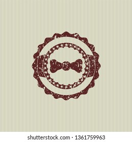 Red bow tie icon inside distress rubber grunge stamp