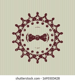 Icono de corbata del arco rojo dentro de un sello de goma en peligro