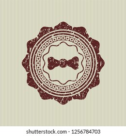 Red bow tie icon with rubber seal texture