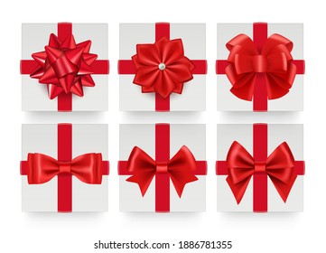 Red bows top view. Realistic gift bow with ribbon. White present boxes decorations vector set