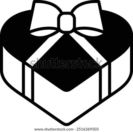 A red box with a yellow bow on top. The box is shaped like a heart. It could be a gift for someone special