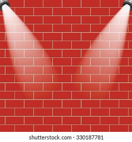 Red brick wall is illuminated by the rays of light.Empty brick wall with a place for your design