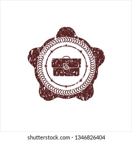 Red briefcase icon inside distressed rubber stamp with grunge texture