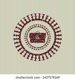 Red briefcase icon inside grunge stamp