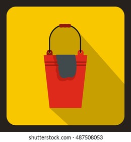 Red bucket and rag icon in flat style on a yellow background vector illustration