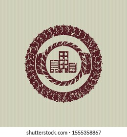 Red buildings icon inside distressed rubber grunge seal