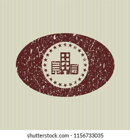Red buildings icon inside rubber grunge stamp