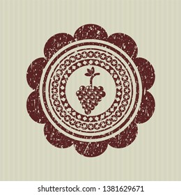 Red bunch of grapes icon inside distress rubber seal