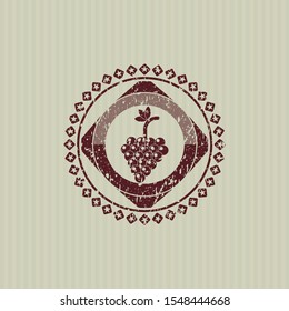 Red bunch of grapes icon inside rubber texture