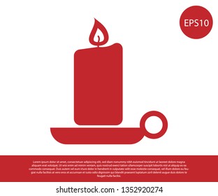 Red Burning candle in candlestick icon isolated on white background. Old fashioned lit candle. Cylindrical aromatic candle stick with burning flame. Vector Illustration
