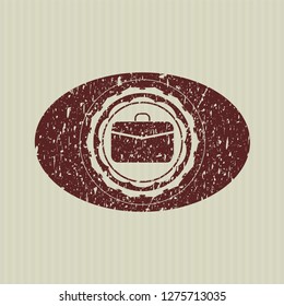 Red business briefcase icon inside grunge style stamp