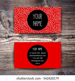 Red Business card template with creative white brush strokes texture on wooden background