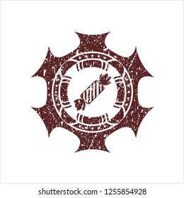 Red candy icon inside distress rubber seal with grunge texture