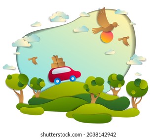 Red car with baggage in scenic nature landscape, green fields and trees, birds and clouds in the sky, paper cut style vector illustration of summer holidays travel and tourism, family or friends.