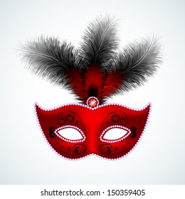 Red carnival mask with feathers