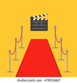 Red carpet and rope barrier golden stanchions turnstile Clapper movie cinema board. Isolated template Yellow background. Flat design Vector illustration