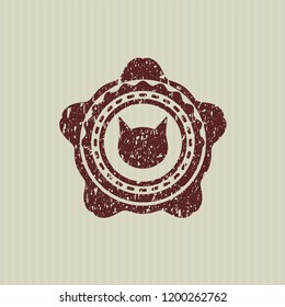 Red cat face icon inside distressed with rubber seal texture