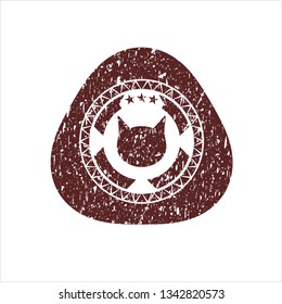 Red cat face icon inside distressed rubber seal