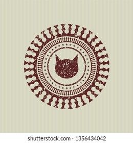 Red cat face icon inside rubber seal with grunge texture
