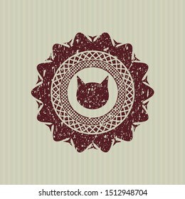 Red cat face icon inside distress rubber seal with grunge texture