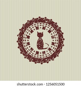 Red cat icon inside distressed rubber seal