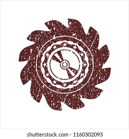 Red CD or DVD disc icon inside distress grunge stamp