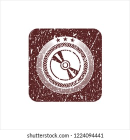 Red CD or DVD disc icon inside distressed grunge style stamp