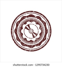 Red CD or DVD disc icon inside rubber stamp with grunge texture