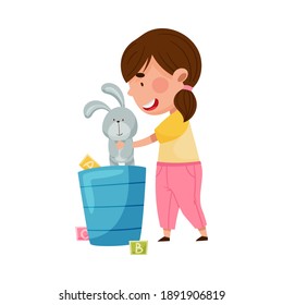 Red Cheeked Girl Playing with Stuffed Hare Toy in Playroom Vector Illustration